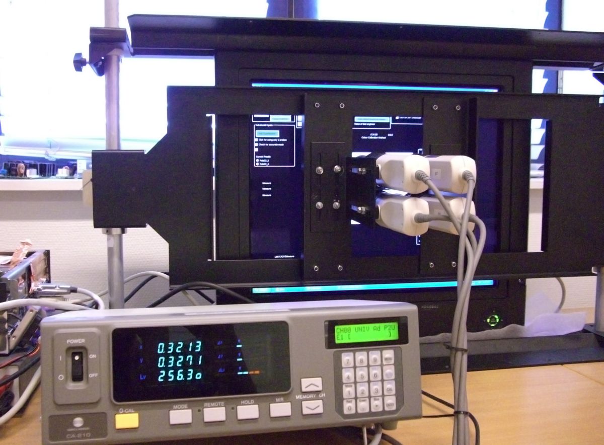The image shows instruments used for color calibration at Hatteland Technology's production facility.