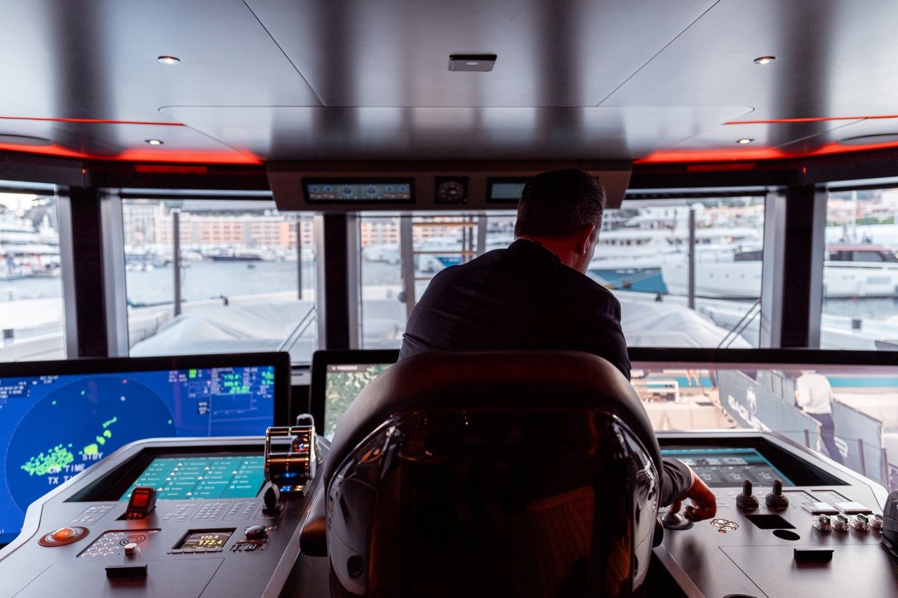 Mr. Massimo Bugli demonstrating how to operate the bridge via the captain’s console and its so-called “islands” on board the Baglietto T52 at the Monaco Yacht Show 2023.