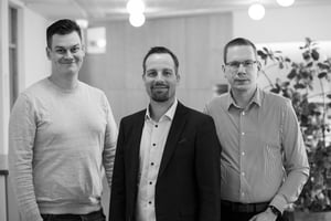 The photo shows the Hatteland Technology team in Finland. From the left, Mikko Joking, Marco Ylä-Kojola, and Timo Myllylä. They are smiling, facing the camera.