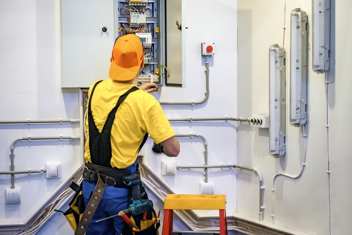 electrician working in electrical cabinet